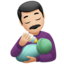 man feeding baby: light skin tone on Apple