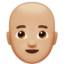 man: medium-light skin tone, bald on Apple
