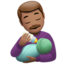 man feeding baby: medium skin tone on Apple