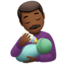 man feeding baby: medium-dark skin tone on Apple