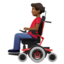 man in motorized wheelchair: medium-dark skin tone on Apple