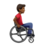 man in manual wheelchair facing right: medium-dark skin tone on Apple