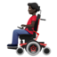 man in motorized wheelchair: dark skin tone on Apple