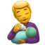 man feeding baby on Apple
