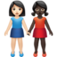 women holding hands: light skin tone, dark skin tone on Apple