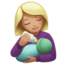 woman feeding baby: medium-light skin tone on Apple