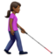 woman with white cane facing right: medium-dark skin tone on Apple