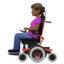 woman in motorized wheelchair: medium-dark skin tone on Apple