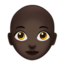 woman: dark skin tone, bald on Apple