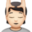person getting massage: light skin tone on Apple