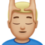 man getting massage: medium-light skin tone on Apple