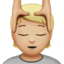 person getting massage: medium-light skin tone on Apple