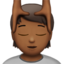 person getting massage: medium-dark skin tone on Apple