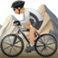person mountain biking: medium-light skin tone on Apple
