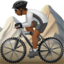 person mountain biking: medium-dark skin tone on Apple