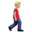 man walking facing right: medium-light skin tone on Apple