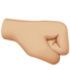 right-facing fist: medium-light skin tone on Apple