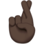 crossed fingers: dark skin tone on Apple