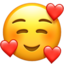 smiling face with hearts on Apple