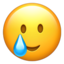 smiling face with tear on Apple