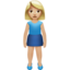 woman standing: medium-light skin tone on Apple