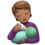 person feeding baby: medium skin tone on Apple