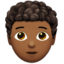 person: medium-dark skin tone, curly hair on Apple