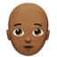 person: medium-dark skin tone, bald on Apple