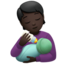 person feeding baby: dark skin tone on Apple