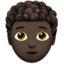 person: dark skin tone, curly hair on Apple