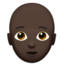 person: dark skin tone, bald on Apple