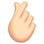 hand with index finger and thumb crossed: light skin tone on Apple