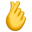 hand with index finger and thumb crossed on Apple