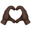 heart hands: dark skin tone on Apple
