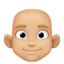 man: medium-light skin tone, bald on Facebook