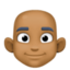 man: medium-dark skin tone, bald on Facebook