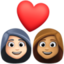 couple with heart: woman, woman, light skin tone, medium skin tone on Facebook