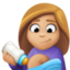 woman feeding baby: medium-light skin tone on Facebook