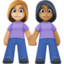 women holding hands: medium-light skin tone, medium-dark skin tone on Facebook