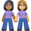 women holding hands: medium-dark skin tone, medium-light skin tone on Facebook
