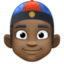 person with skullcap: dark skin tone on Facebook