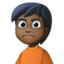person frowning: dark skin tone on Facebook