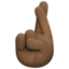 crossed fingers: dark skin tone on Facebook