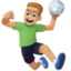 man playing handball: medium-light skin tone on Facebook