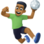 man playing handball: medium-dark skin tone on Facebook