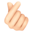 hand with index finger and thumb crossed: light skin tone on Facebook