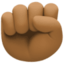 raised fist: medium-dark skin tone on Facebook