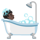 person taking bath: dark skin tone on Google